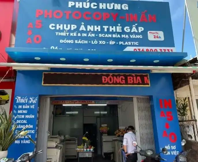 Bảng hiệu photocopy in ấn nền xanh dương, chữ trắng đỏ và bảng LED chạy chữ