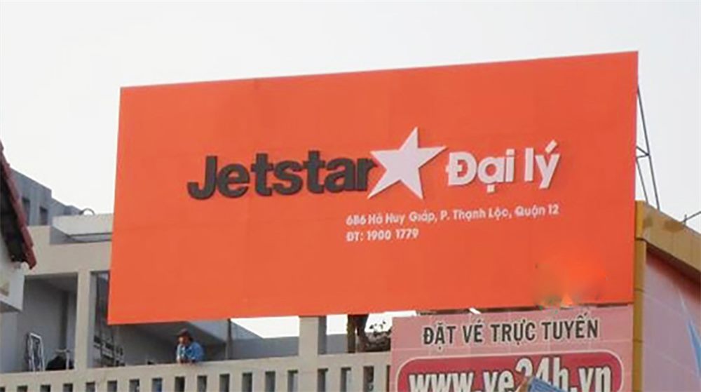 Bảng đại lý Jetstar nền cam, logo ngôi sao và thông tin đại lý