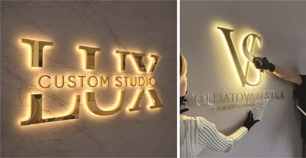 Chữ inox vàng hắt sáng trên tường đá và cảnh thợ đang gắn chữ