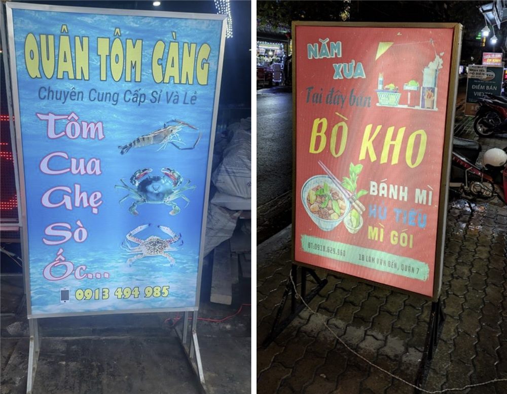 Hai hộp đèn đứng hai mặt của quán hải sản và quán bò kho